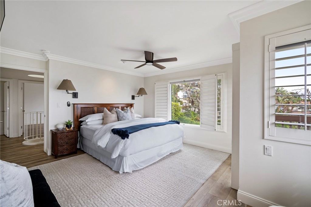 32041 Point Place Laguna Beach, CA 92651 - Photo 25 of 59 a bedroom with a large bed and a window