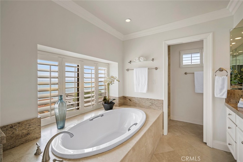 32041 Point Place Laguna Beach, CA 92651 - Photo 29 of 59 a bathroom with a granite countertop tub sink and mirror