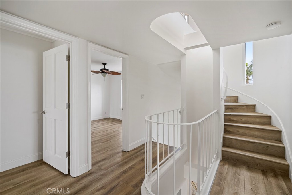 32041 Point Place Laguna Beach, CA 92651 - Photo 34 of 59 a view of hallway with stairs and wooden floor