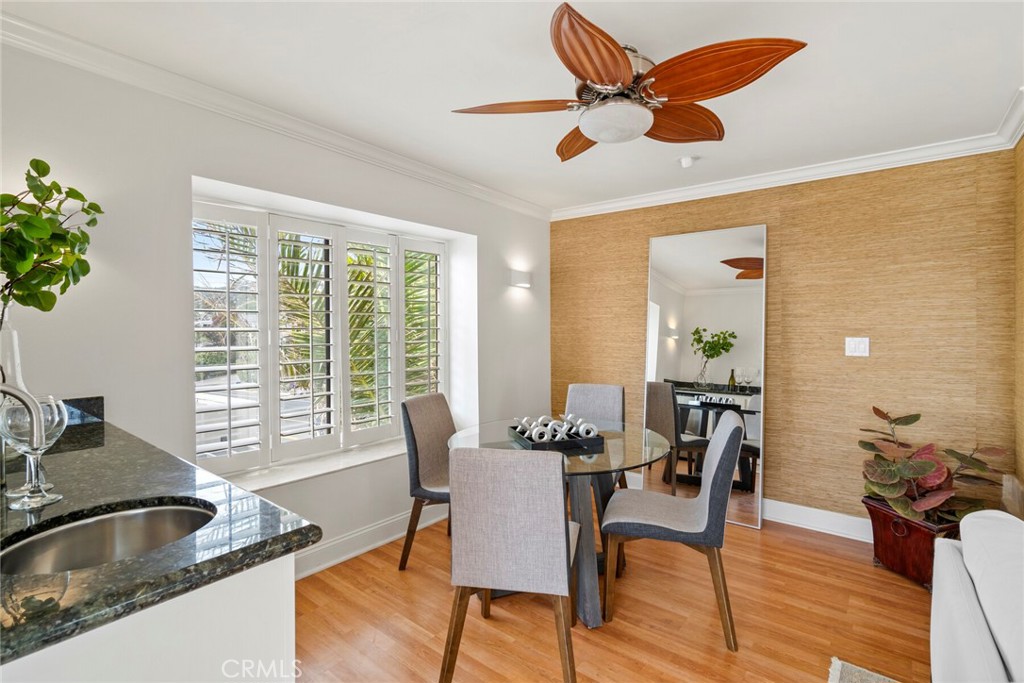 32041 Point Place Laguna Beach, CA 92651 - Photo 41 of 59 a dining room with furniture a chandelier and wooden floor