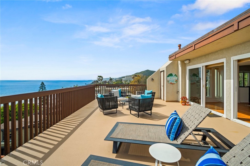 32041 Point Place Laguna Beach, CA 92651 - Photo 44 of 59 a view of a patio with couches table and chairs and potted plants