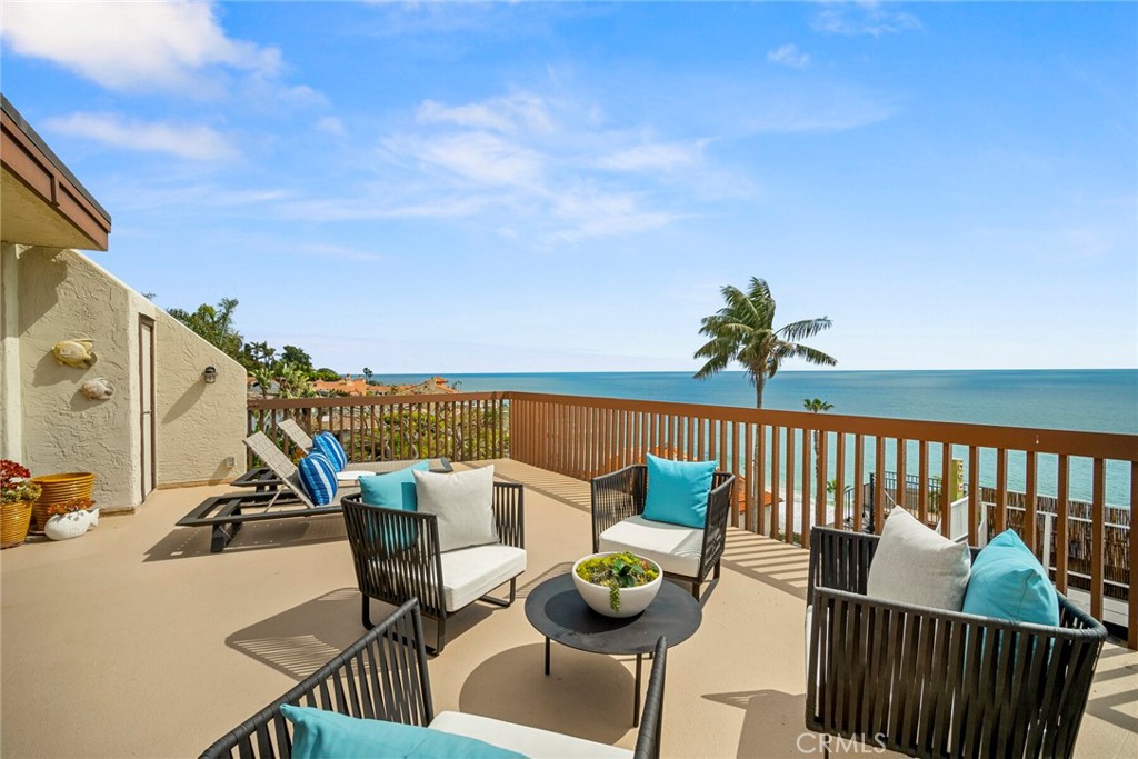32041 Point Place Laguna Beach, CA 92651 - Photo 46 of 59 a roof deck with couches and potted plants with sky view