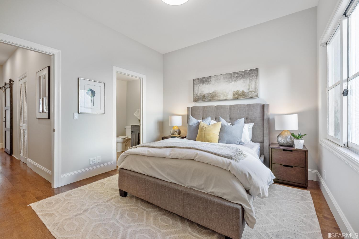 558 Central Avenue San Francisco, CA 94117 - Photo 12 of 23 a bedroom with a bed and wooden floor