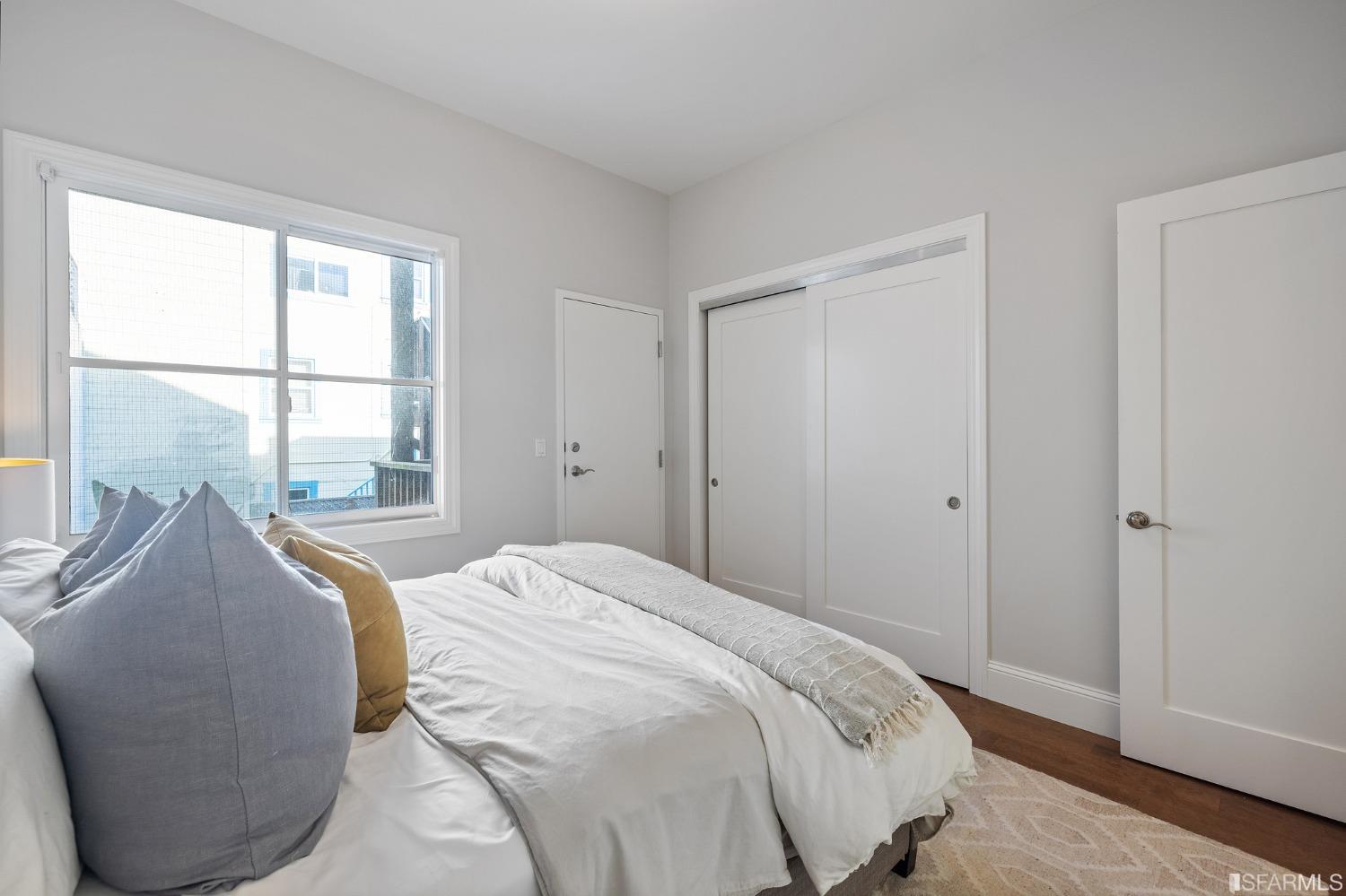 558 Central Avenue San Francisco, CA 94117 - Photo 13 of 23 a bed sitting in a bedroom next to a window