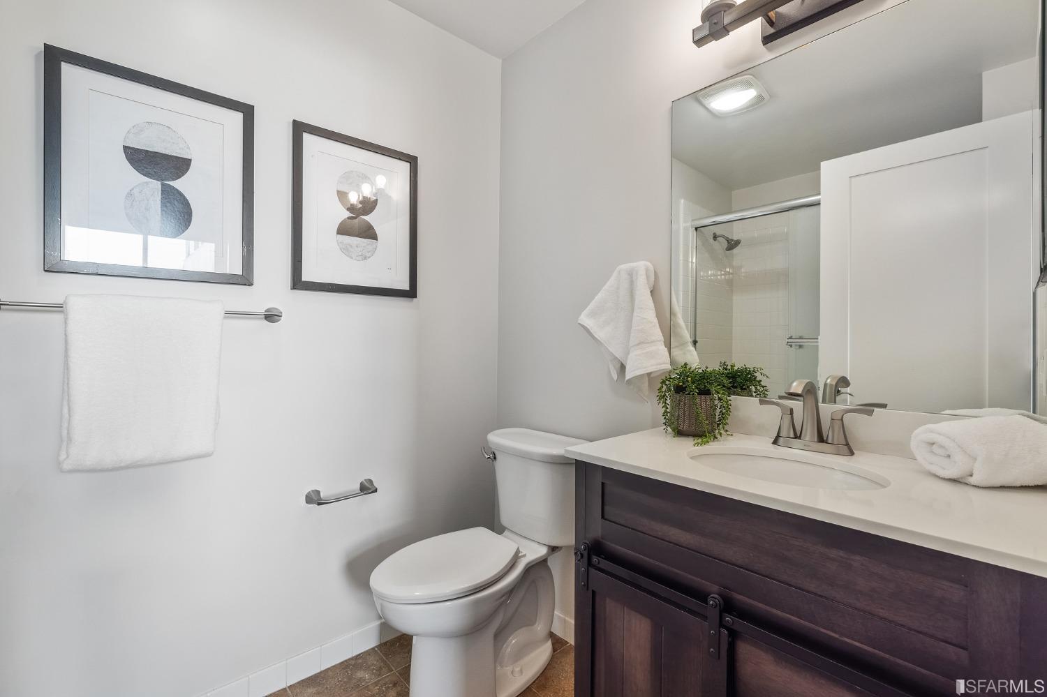 558 Central Avenue San Francisco, CA 94117 - Photo 14 of 23 a bathroom with a toilet sink and mirror
