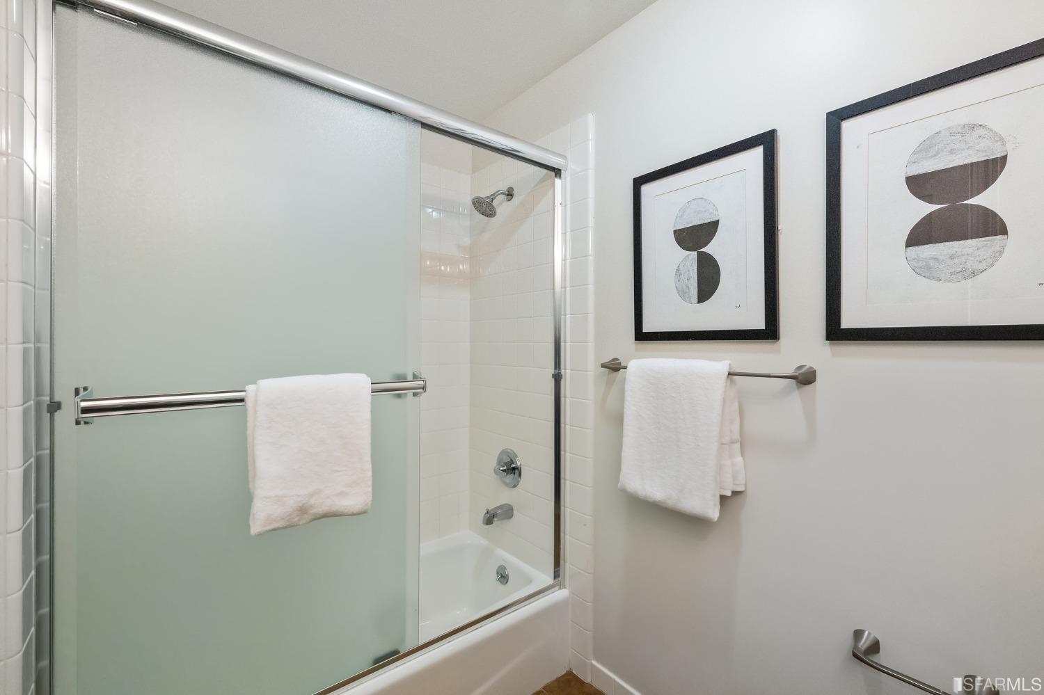 558 Central Avenue San Francisco, CA 94117 - Photo 15 of 23 a bathroom with a shower and mirror