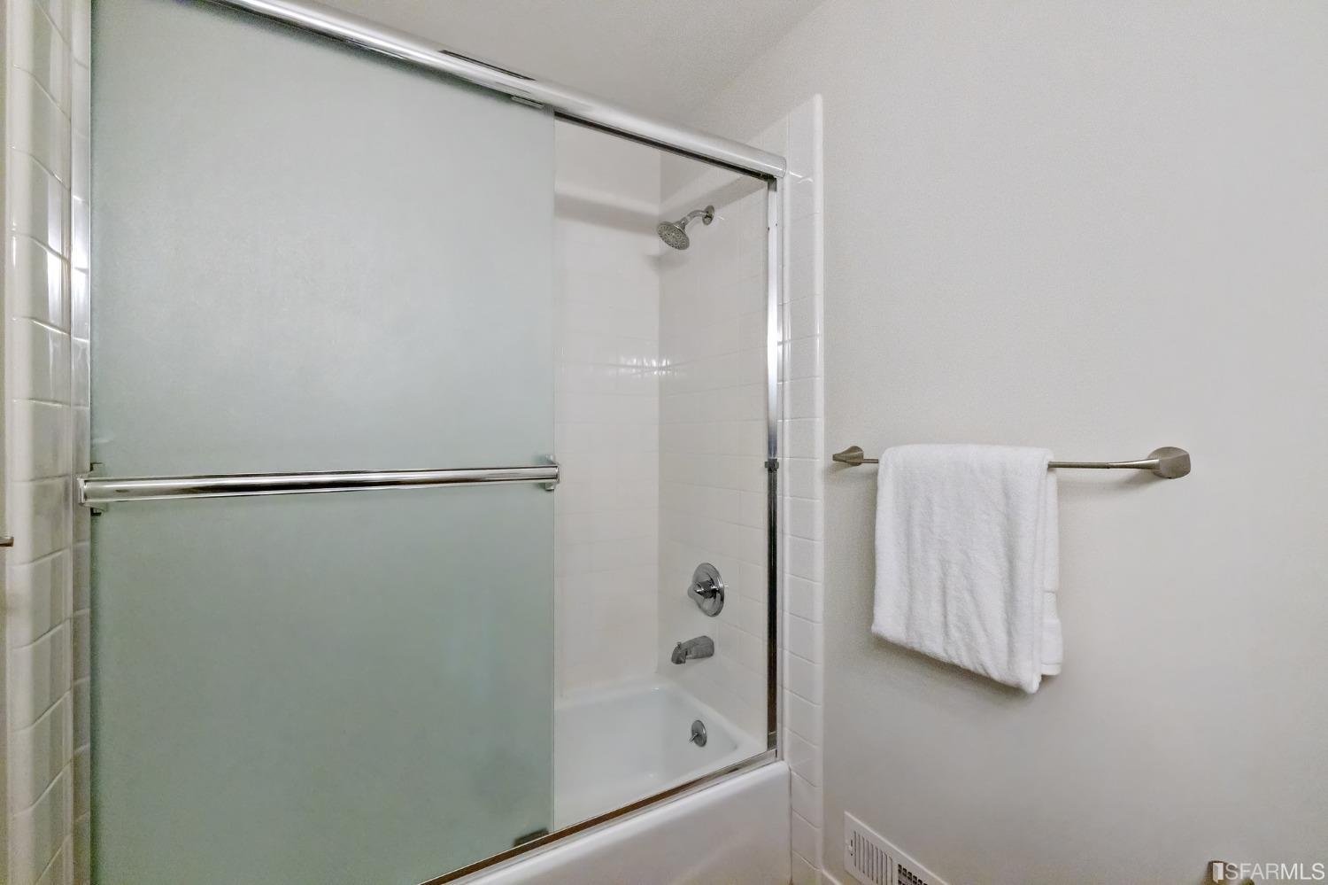 558 Central Avenue San Francisco, CA 94117 - Photo 19 of 23 a bathroom with a glass shower door