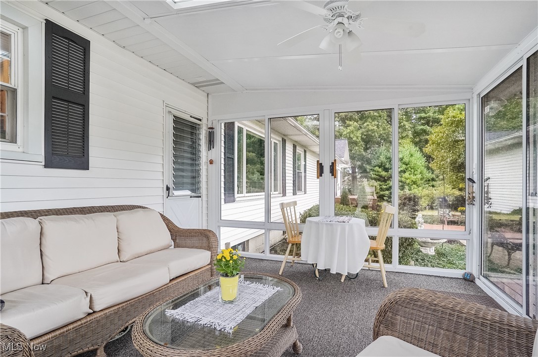 667 North Road Southeast Warren, OH 44484 - Photo 34 of 50 Sunroom / solarium featuring healthy amount of natural light, a ceiling fan, and outdoor lounge area