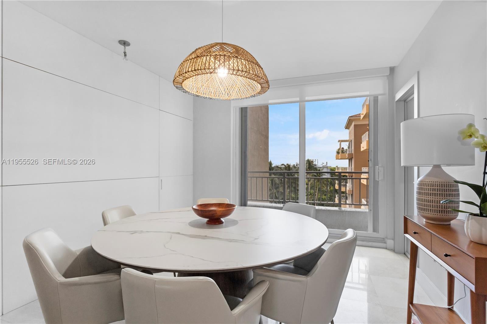 765 Crandon Boulevard, Unit 506 Key Biscayne, FL 33149 - Photo 12 of 19 a view of a dining room with furniture and wooden floor