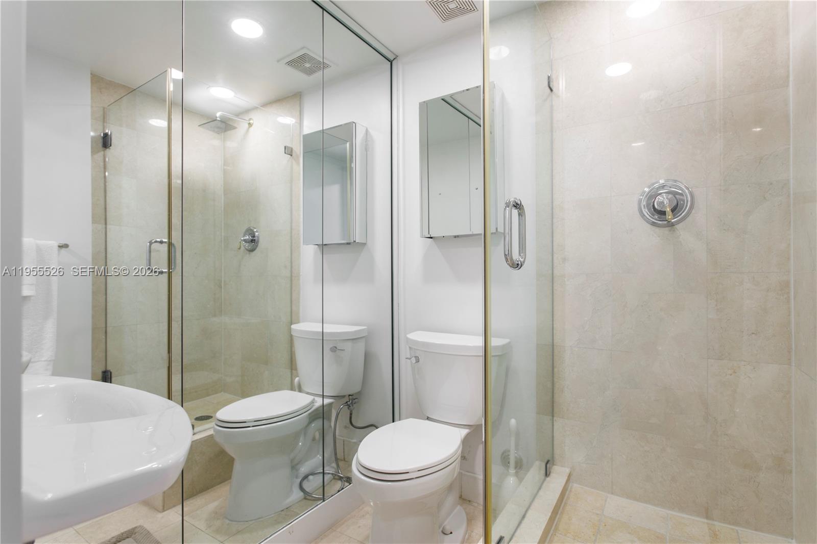 765 Crandon Boulevard, Unit 506 Key Biscayne, FL 33149 - Photo 15 of 19 a bathroom with a toilet sink and shower