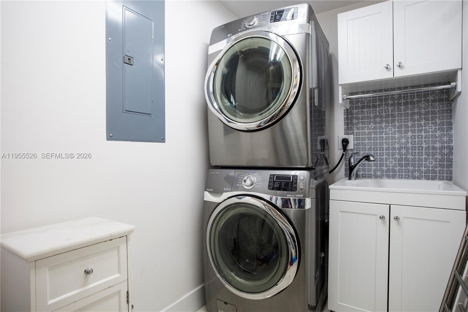 765 Crandon Boulevard, Unit 506 Key Biscayne, FL 33149 - Photo 16 of 19 a close up view of a washer and dryer