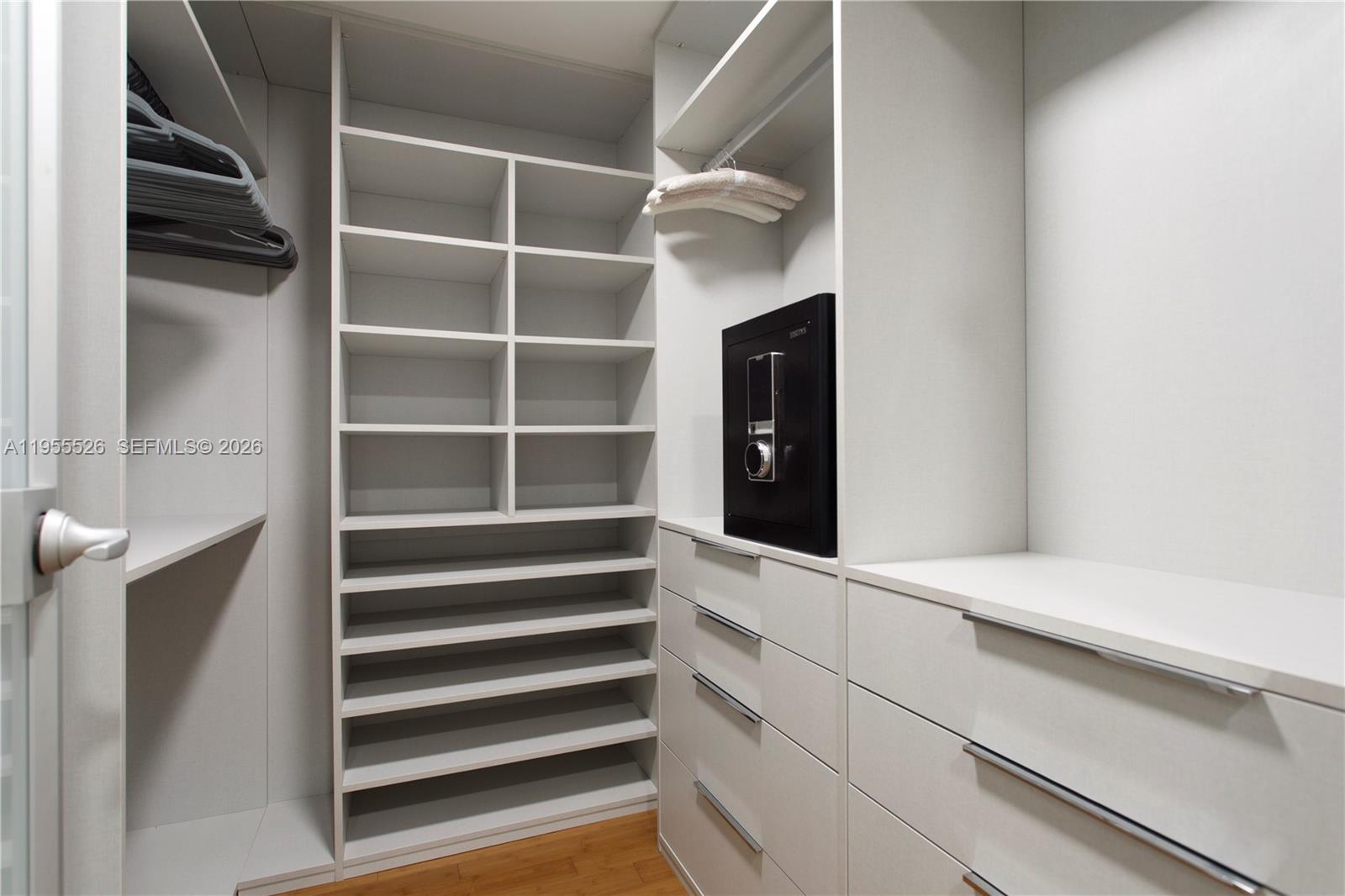 765 Crandon Boulevard, Unit 506 Key Biscayne, FL 33149 - Photo 6 of 19 a view of walk in closet with empty racks