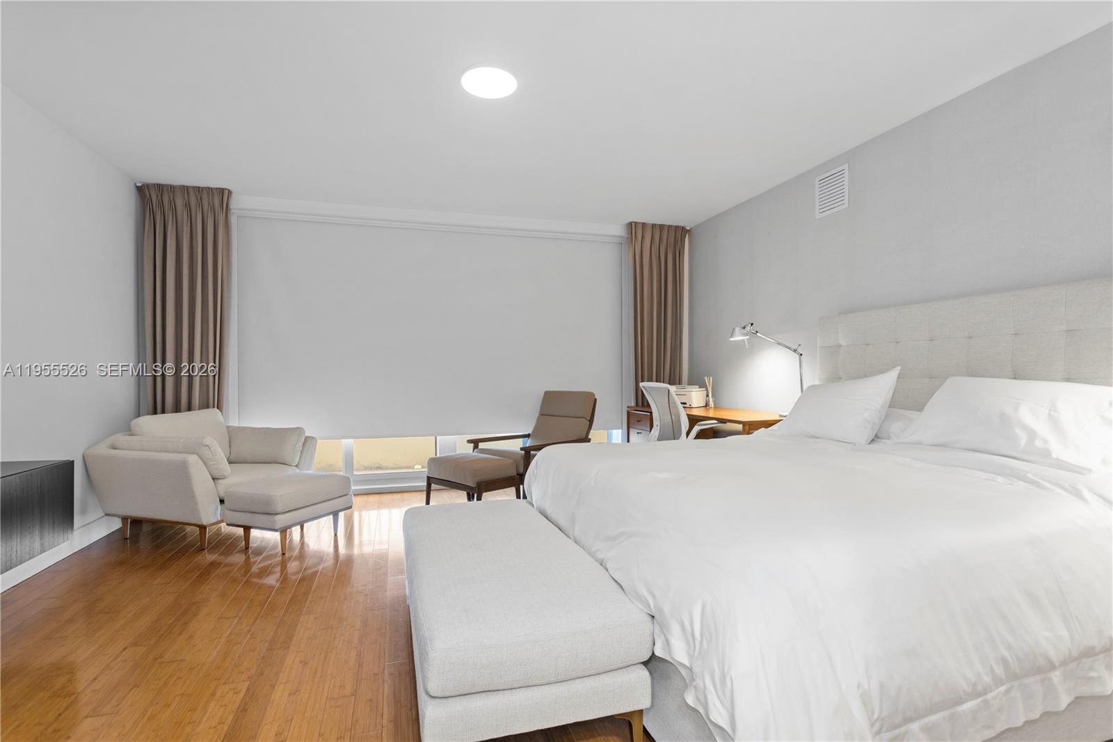 765 Crandon Boulevard, Unit 506 Key Biscayne, FL 33149 - Photo 7 of 19 a bedroom with a bed and a couch