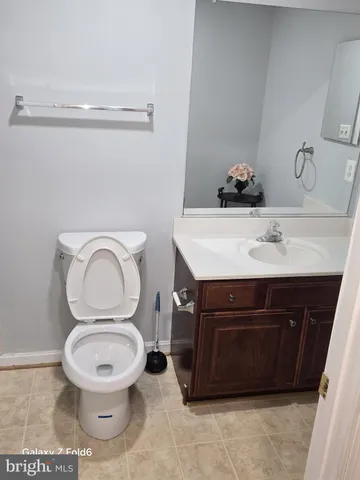 a bathroom with a toilet and a sink