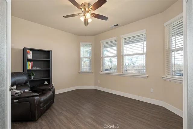 a view of a dining room with furniture and windows