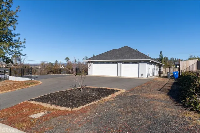a view of a park with large trees