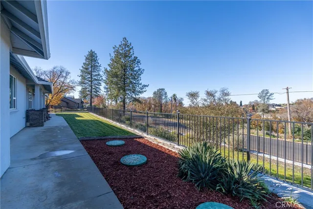 a backyard of a house with lots of green space