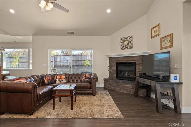 a living room with furniture and a fireplace