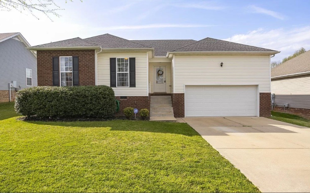 415 Berry Circle Springfield, TN 37172 - Photo 1 of 1 a front view of a house with garden