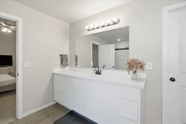 a bathroom with a sink double vanity and a mirror