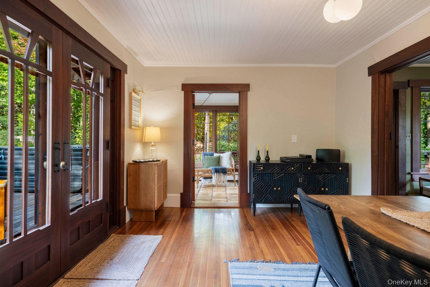 64 Lower Byrdcliffe Road Woodstock, NY 12498 - Photo 11 of 36 a living room with furniture and a wooden floor