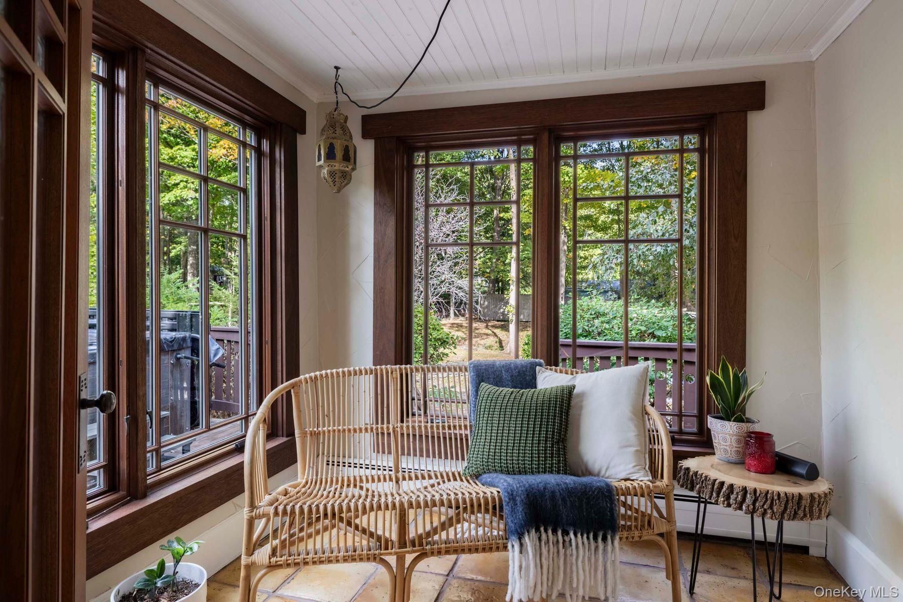 64 Lower Byrdcliffe Road Woodstock, NY 12498 - Photo 13 of 36 a living room with furniture and a window