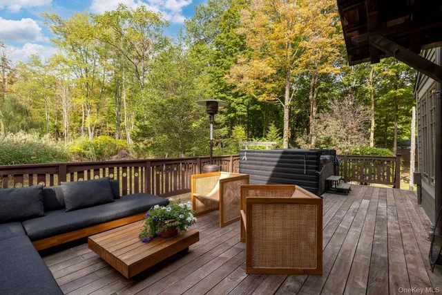 a view of sitting area with furniture in wooden floor