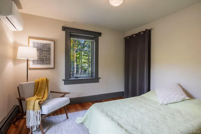 a bedroom with furniture and a window