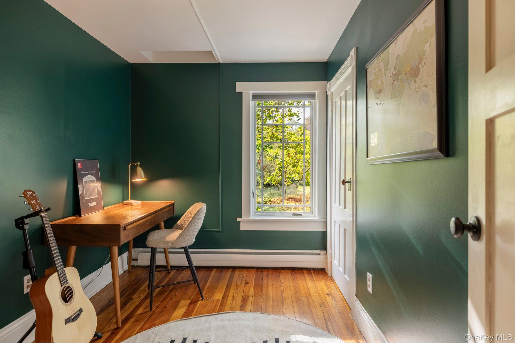 64 Lower Byrdcliffe Road Woodstock, NY 12498 - Photo 21 of 36 a view of a dining room with furniture and a window