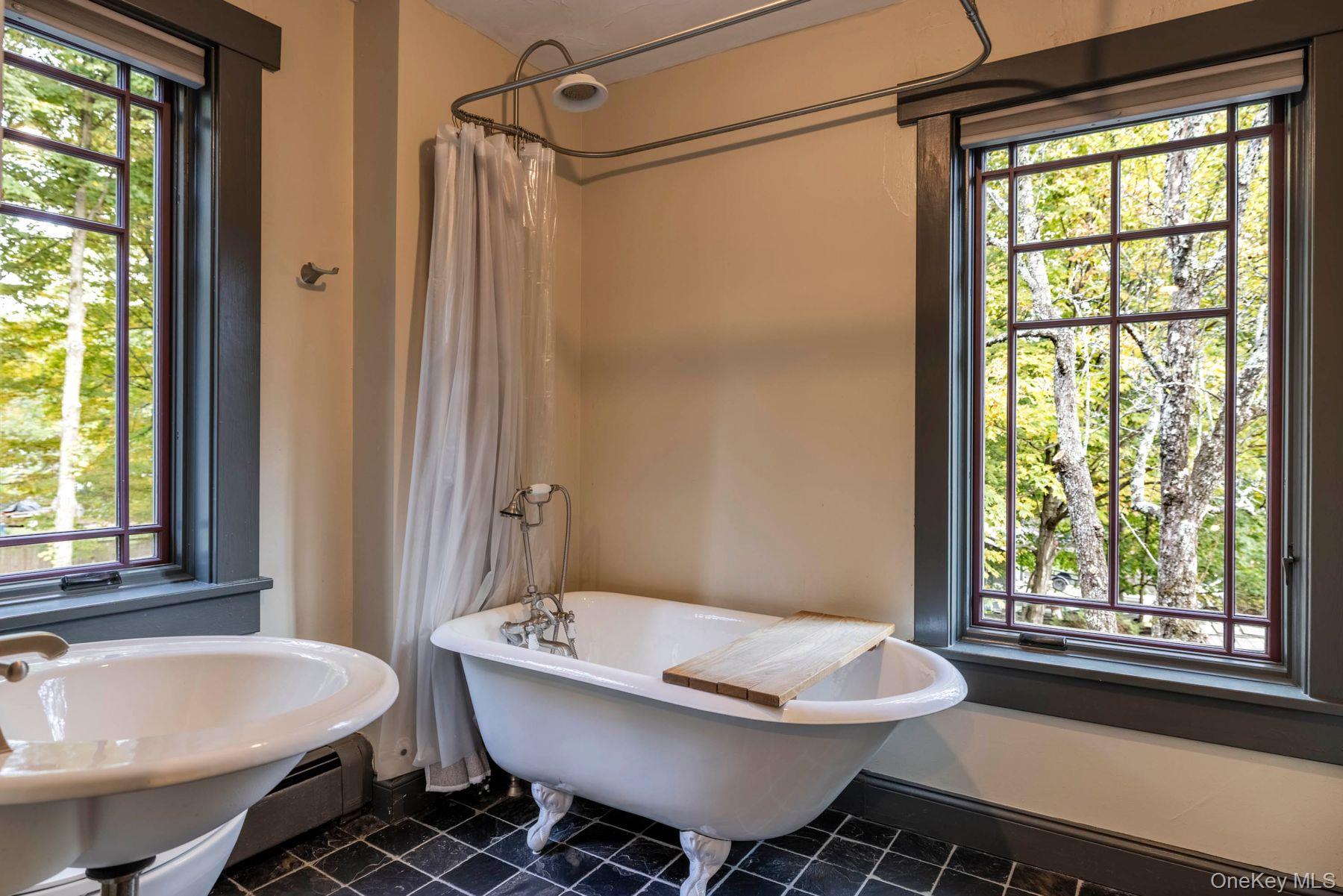 64 Lower Byrdcliffe Road Woodstock, NY 12498 - Photo 23 of 36 a bathroom with a sink and a mirror