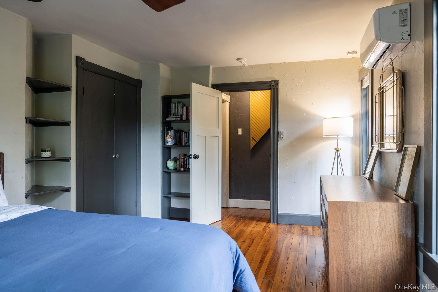 64 Lower Byrdcliffe Road Woodstock, NY 12498 - Photo 24 of 36 a bedroom with a bed and a mirror