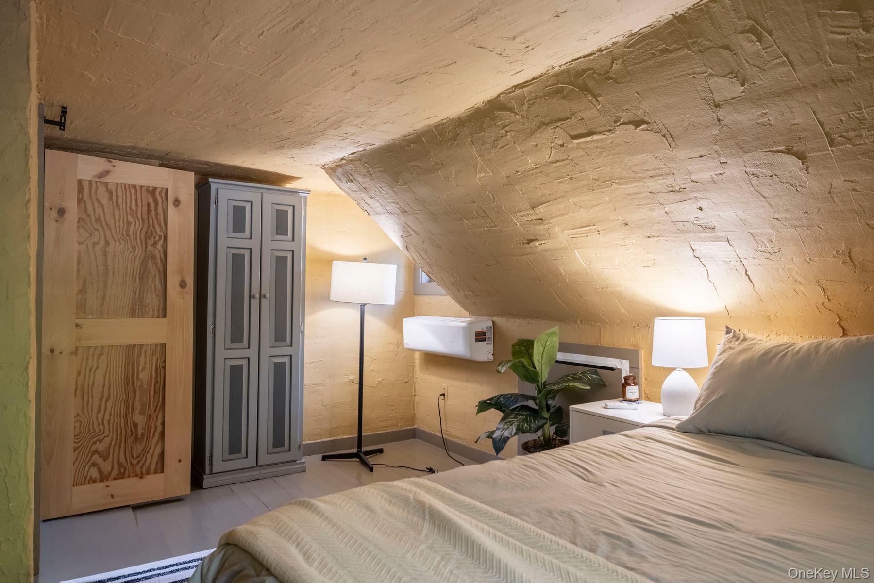 64 Lower Byrdcliffe Road Woodstock, NY 12498 - Photo 27 of 36 a view of a bedroom with furniture and a window