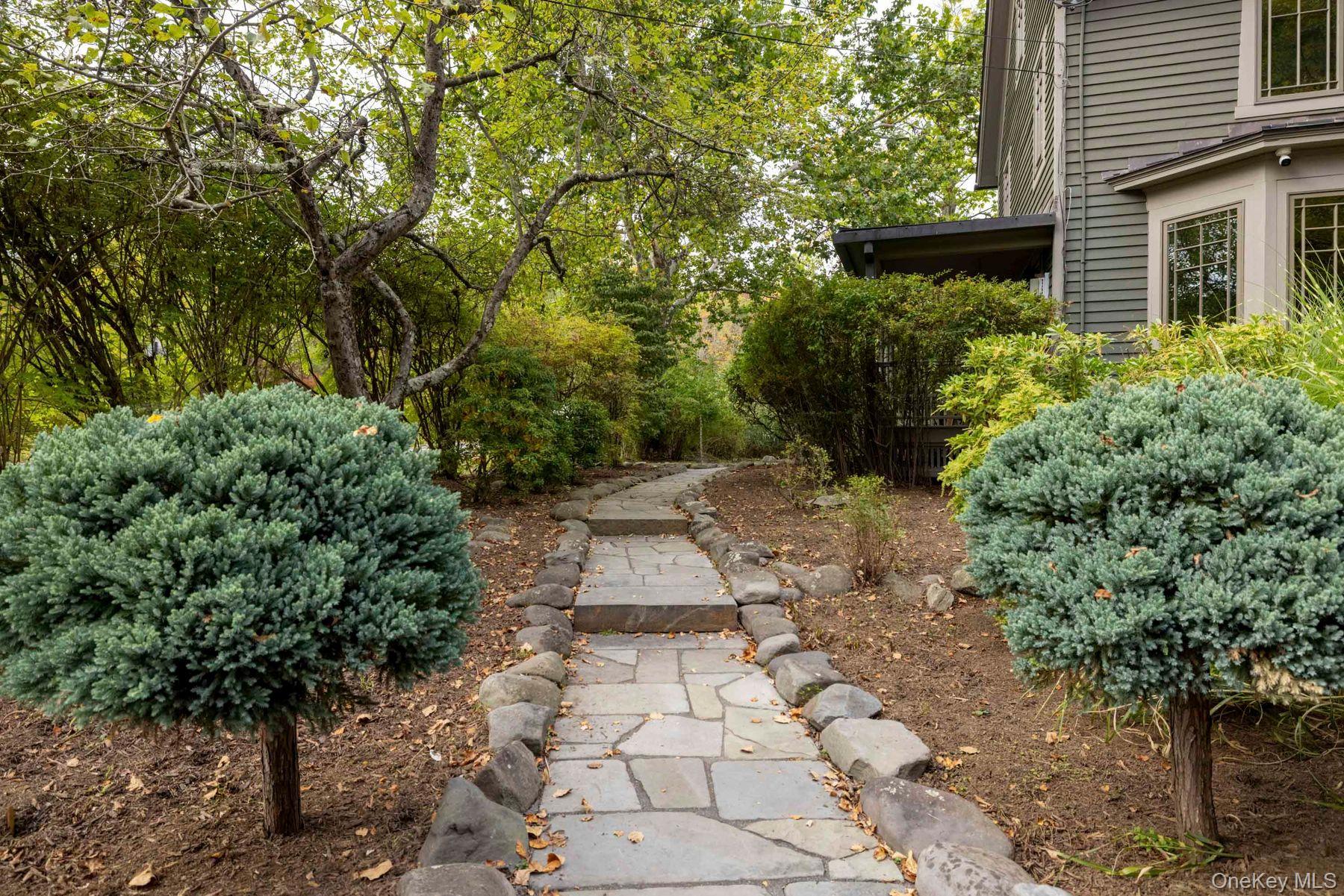 64 Lower Byrdcliffe Road Woodstock, NY 12498 - Photo 5 of 36 a view of a pathway both side of house