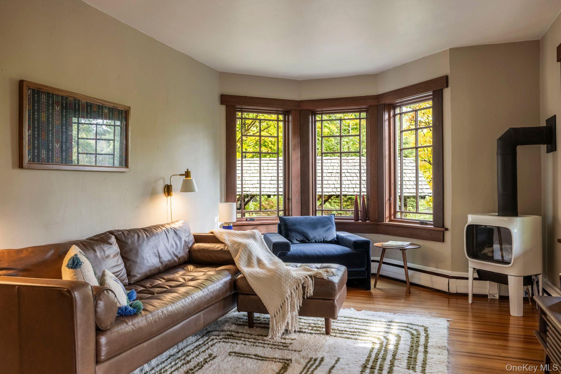 64 Lower Byrdcliffe Road Woodstock, NY 12498 - Photo 8 of 36 a living room with furniture and a window
