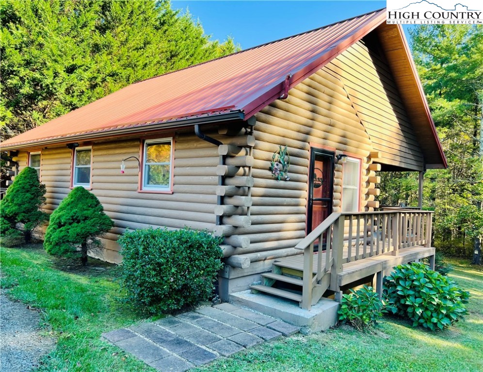 840 Golf Course Road Sparta, NC 28675 - Photo 1 of 35 a view of a house with a yard