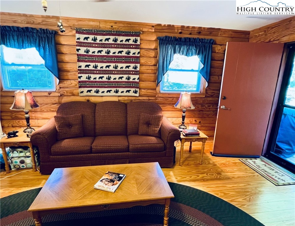 840 Golf Course Road Sparta, NC 28675 - Photo 14 of 35 a living room with a couch and a table