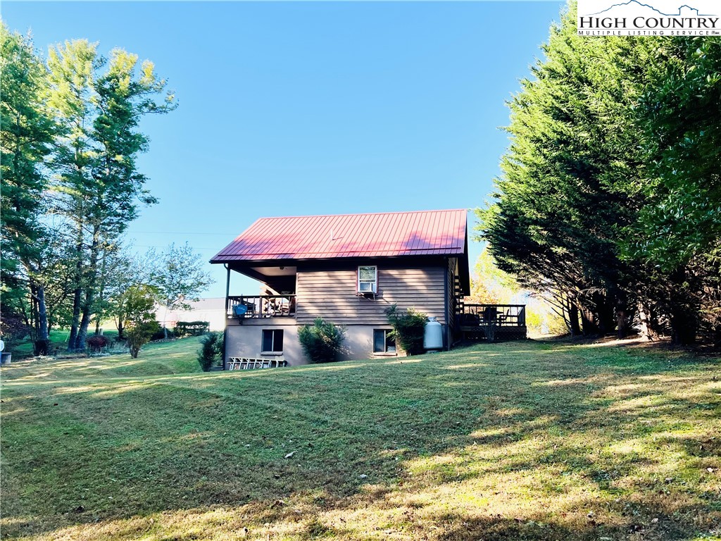 840 Golf Course Road Sparta, NC 28675 - Photo 25 of 35 a view of a house with a big yard