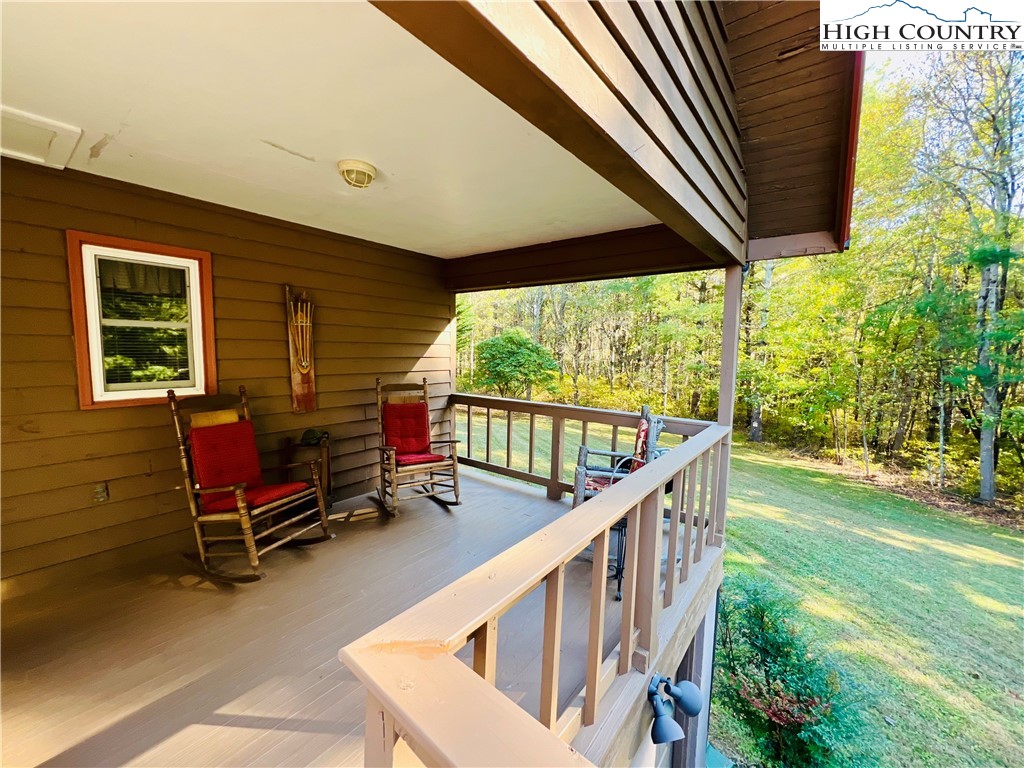 840 Golf Course Road Sparta, NC 28675 - Photo 3 of 35 a balcony with chairs