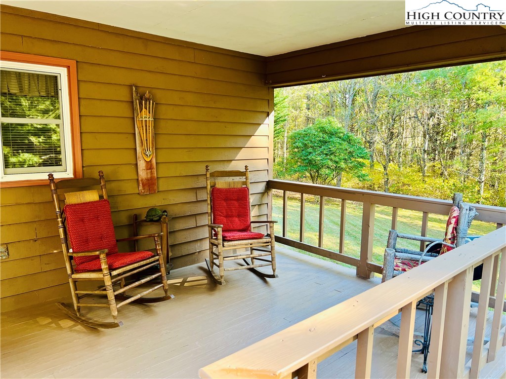 840 Golf Course Road Sparta, NC 28675 - Photo 4 of 35 a balcony with furniture and a window