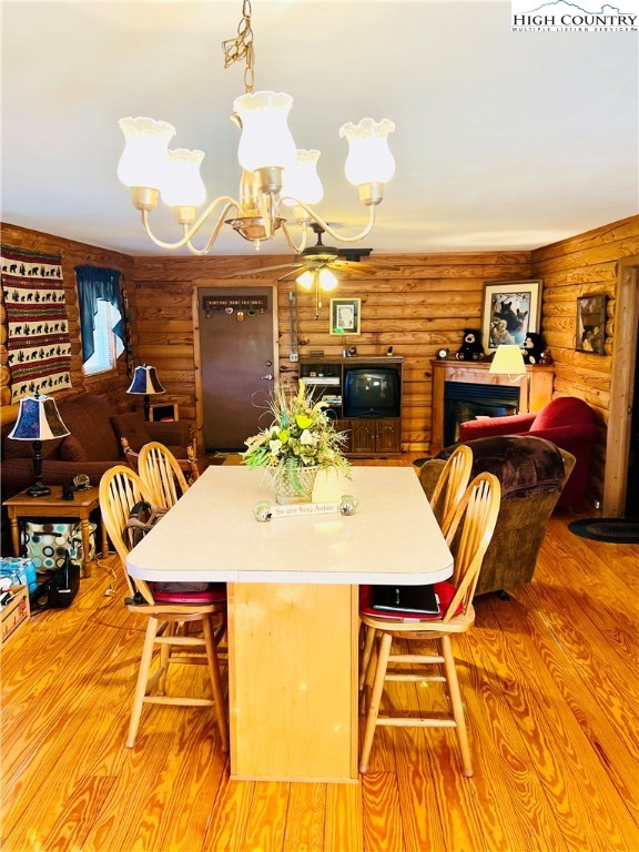 840 Golf Course Road Sparta, NC 28675 - Photo 10 of 35 a view of a dining room with furniture and chandelier