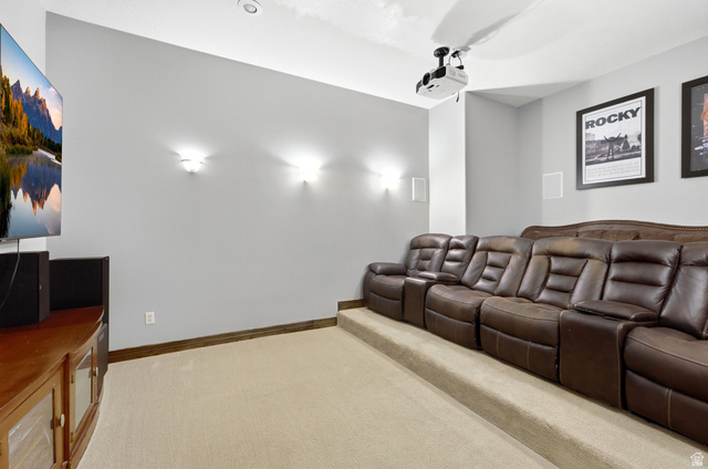 335 Bern Way Midway, UT 84049 - Photo 36 of 88 Dedicated media room featuring tiered seating, recessed ceiling lighting, wall sconces, and built-in wall speakers