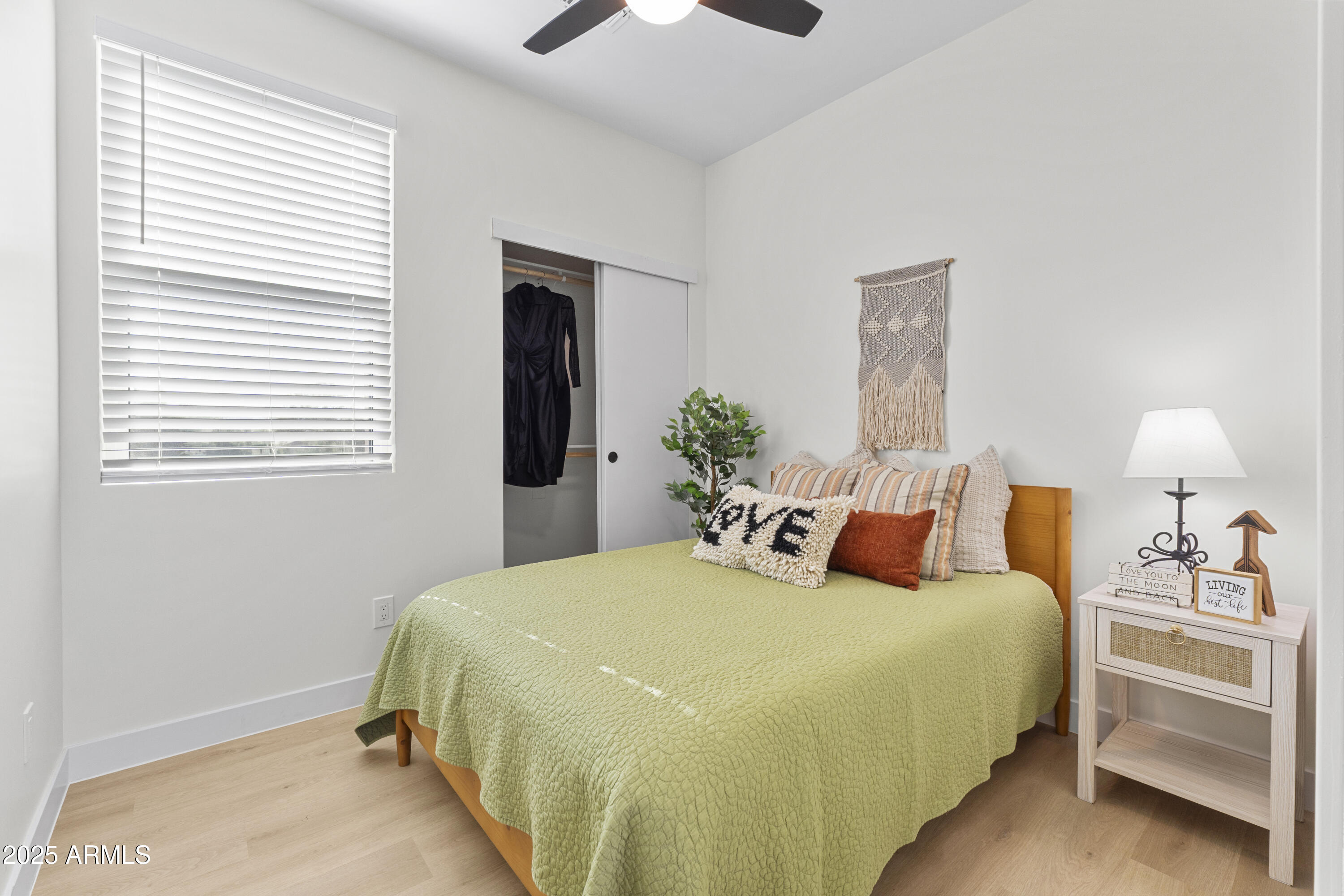 1502 South 14th Street Phoenix, AZ 85034 - Photo 18 of 43 a bedroom with a bed and a chandelier