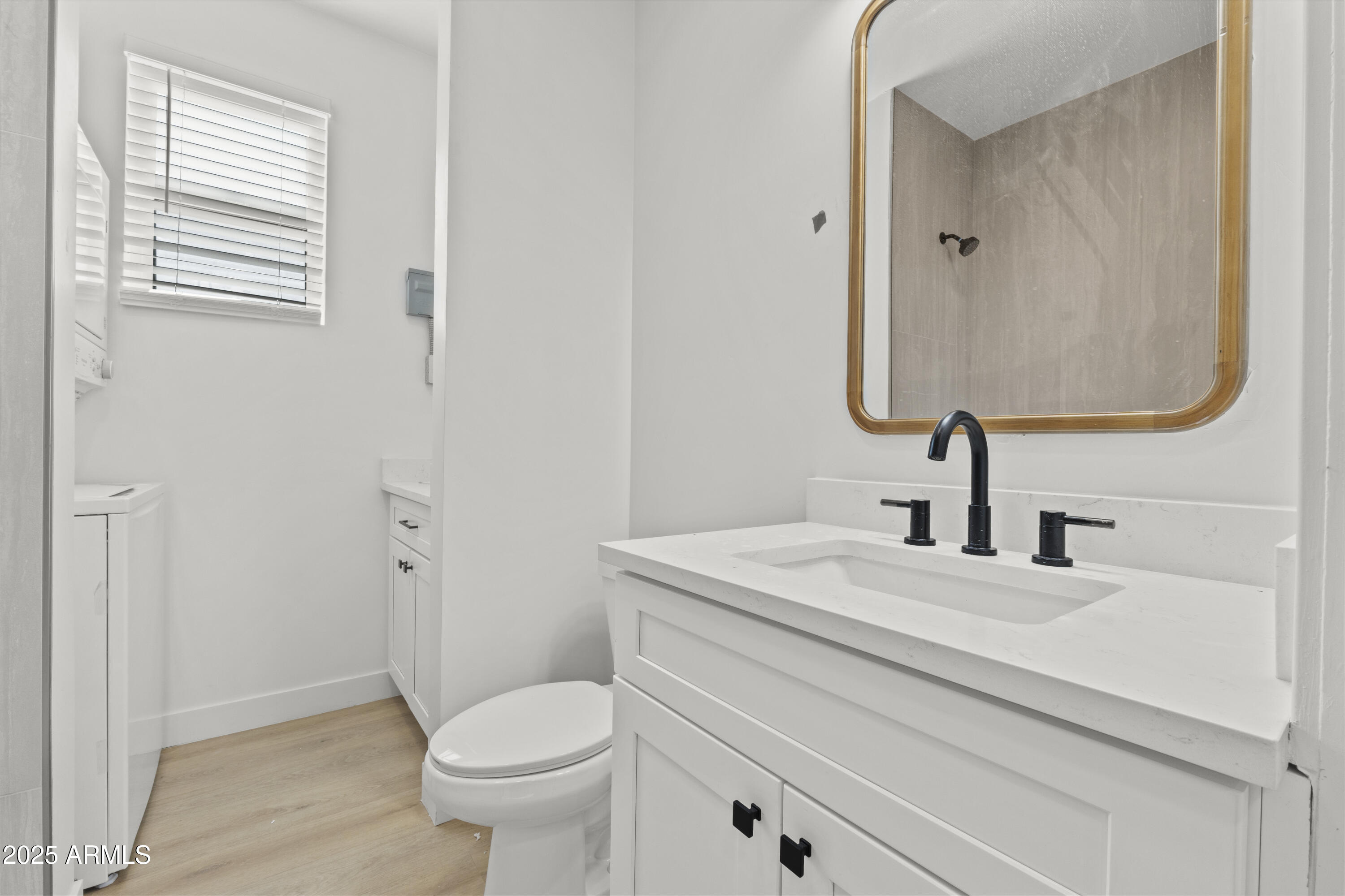 1502 South 14th Street Phoenix, AZ 85034 - Photo 33 of 43 a bathroom with a granite countertop toilet sink and mirror
