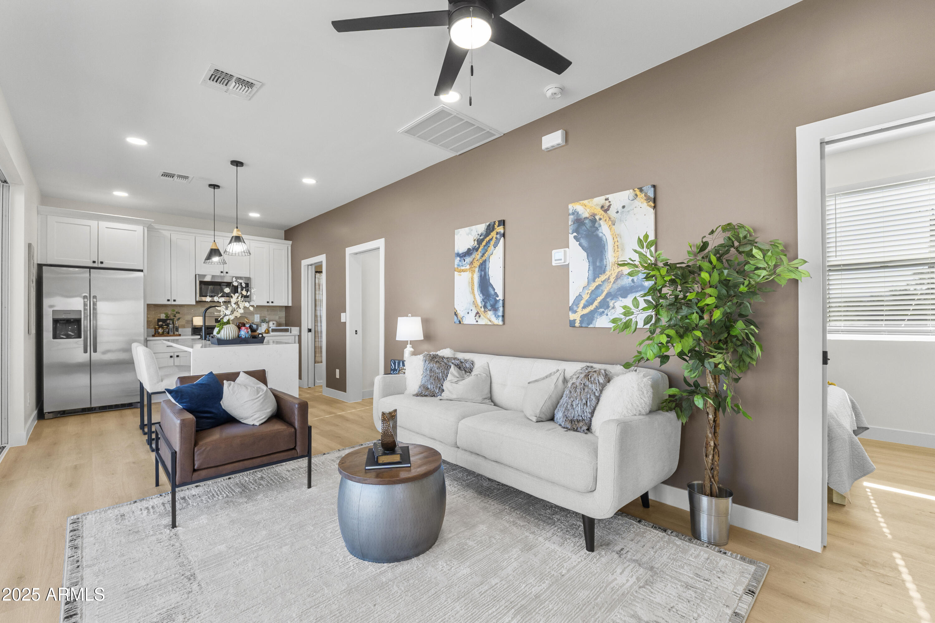 1502 South 14th Street Phoenix, AZ 85034 - Photo 6 of 43 a living room with furniture and a potted plant