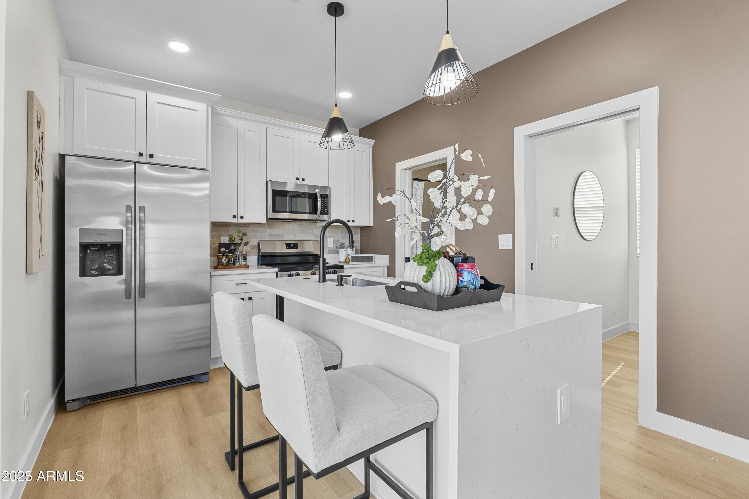 1502 South 14th Street Phoenix, AZ 85034 - Photo 10 of 43 a kitchen with stainless steel appliances a refrigerator sink and microwave