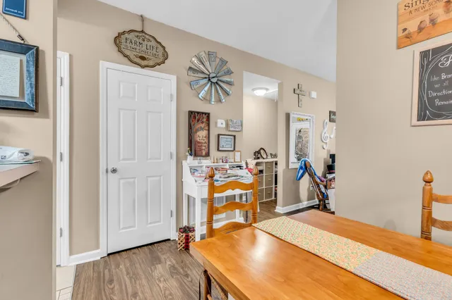 a living room with furniture a rug and a chandelier