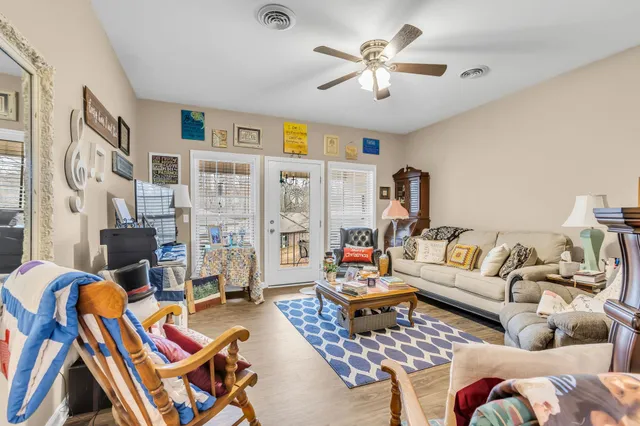 a living room with furniture and a rug