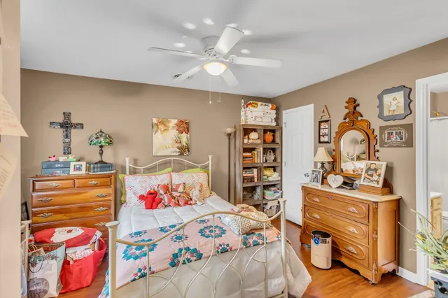 a bedroom with furniture and a book shelf
