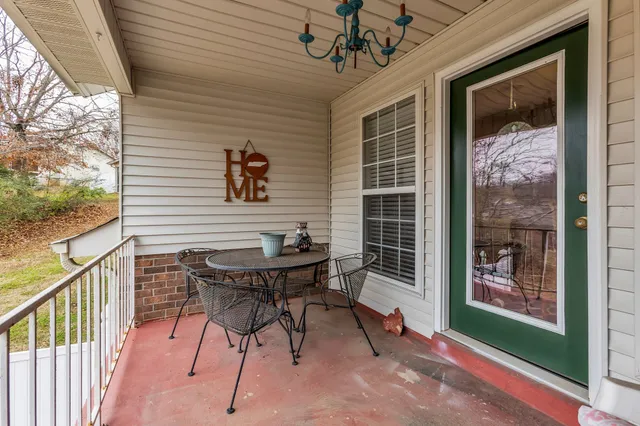 a balcony with furniture and a window