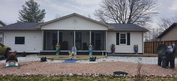 a front view of a house with garden